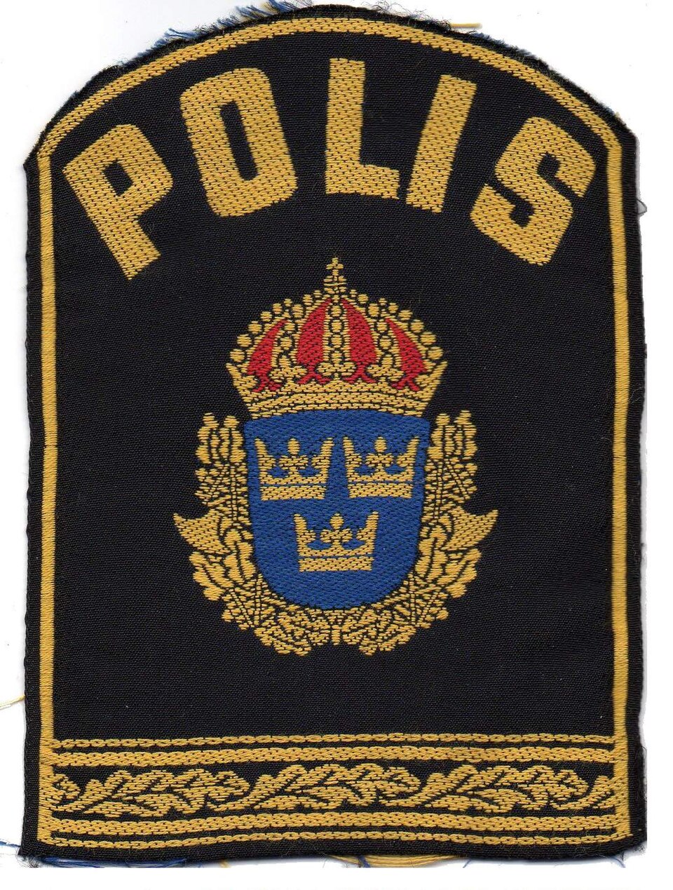 Tygmärke med texten Polis.